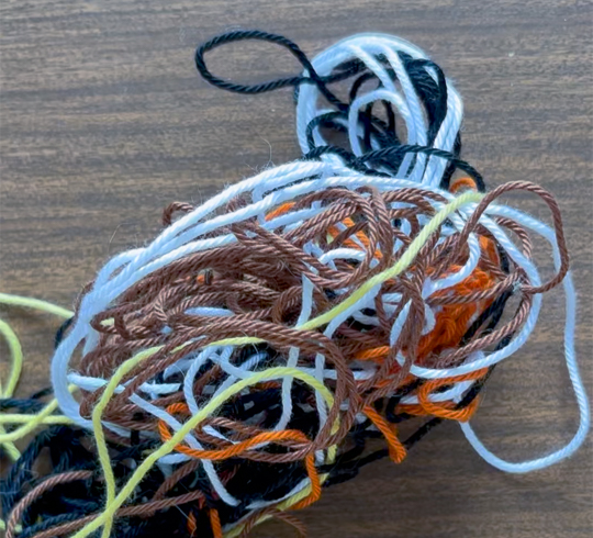 Limited yarn source for easier untangling while doing pixel art tapestry crochet