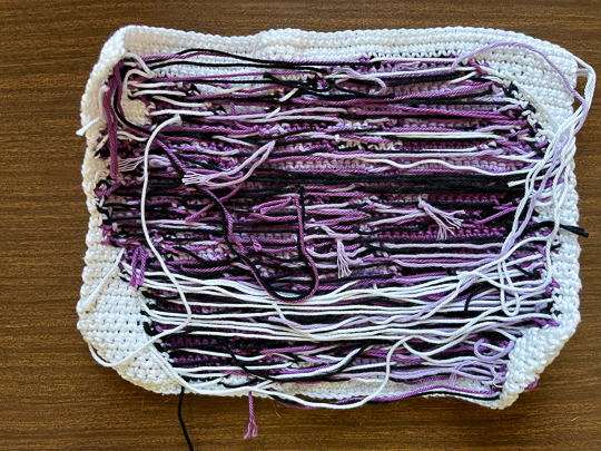Unnecessarily messy yarn in the back of a pixel art tapestry crochet design